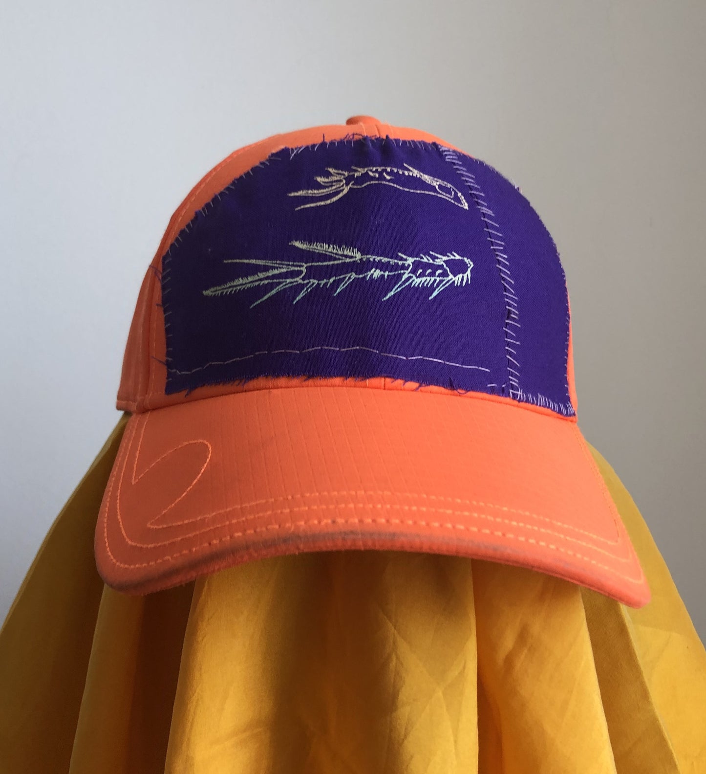 bright orange cap (insect legs)