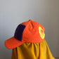 bright orange cap (insect legs)